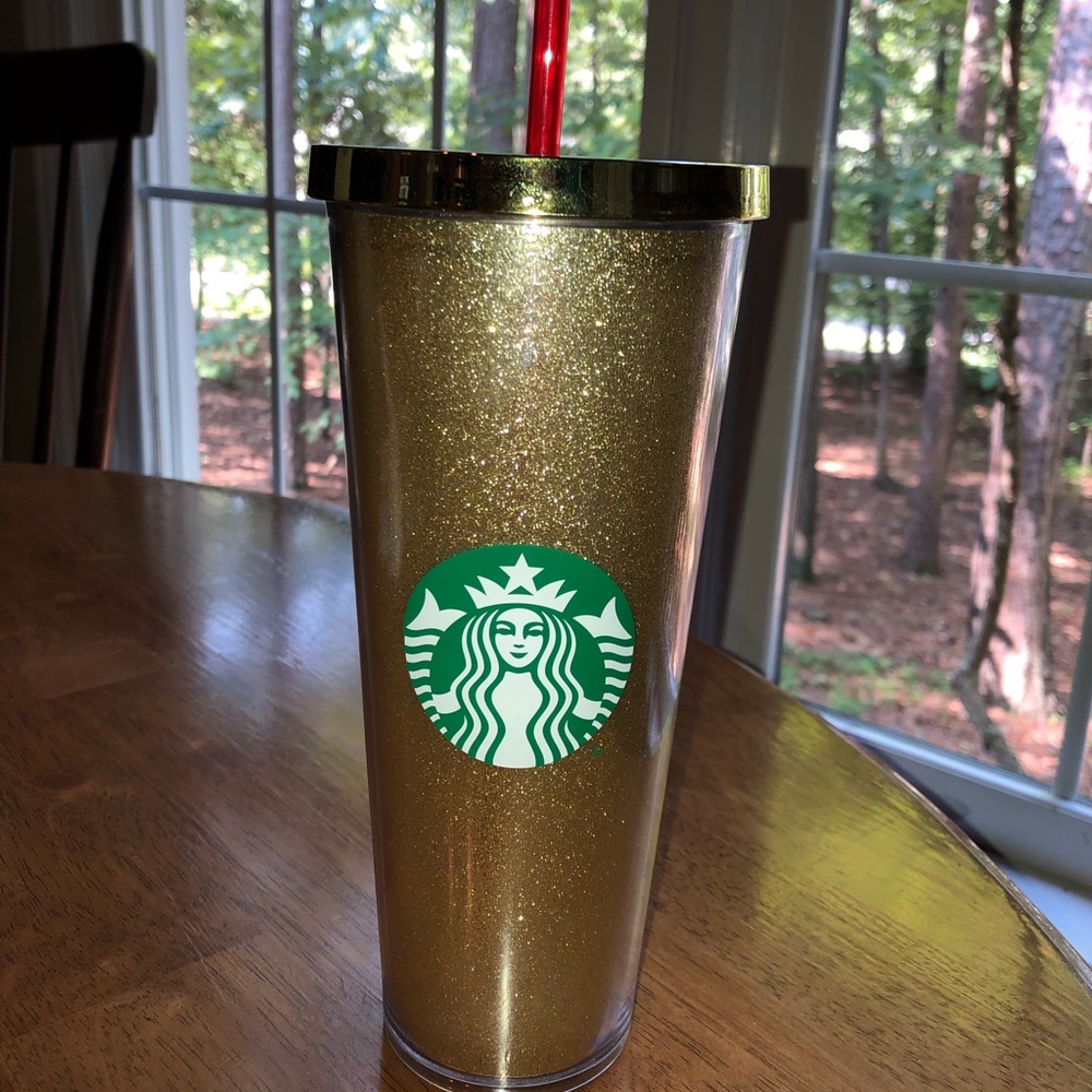 Gold glitter Starbucks tumbler with red straw